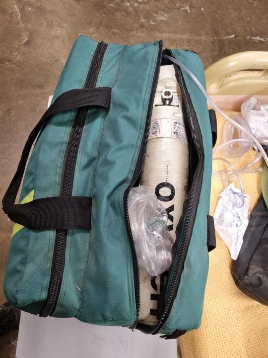 green Paramedic bag and oxygen tank 