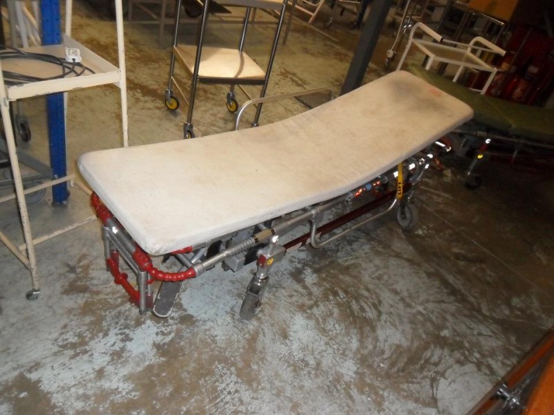 ambulance stretcher  green mattress and white